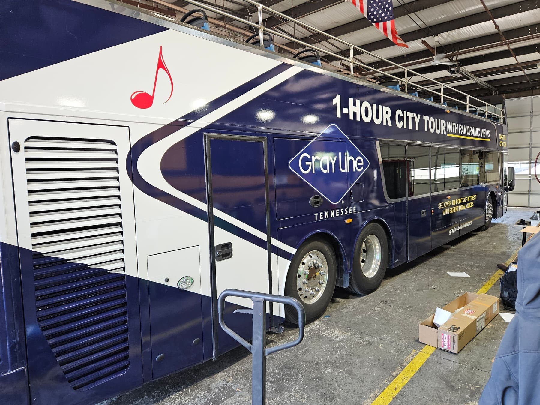 Navy Gray Line double-decker bus in a full Nashville City Tour wrap