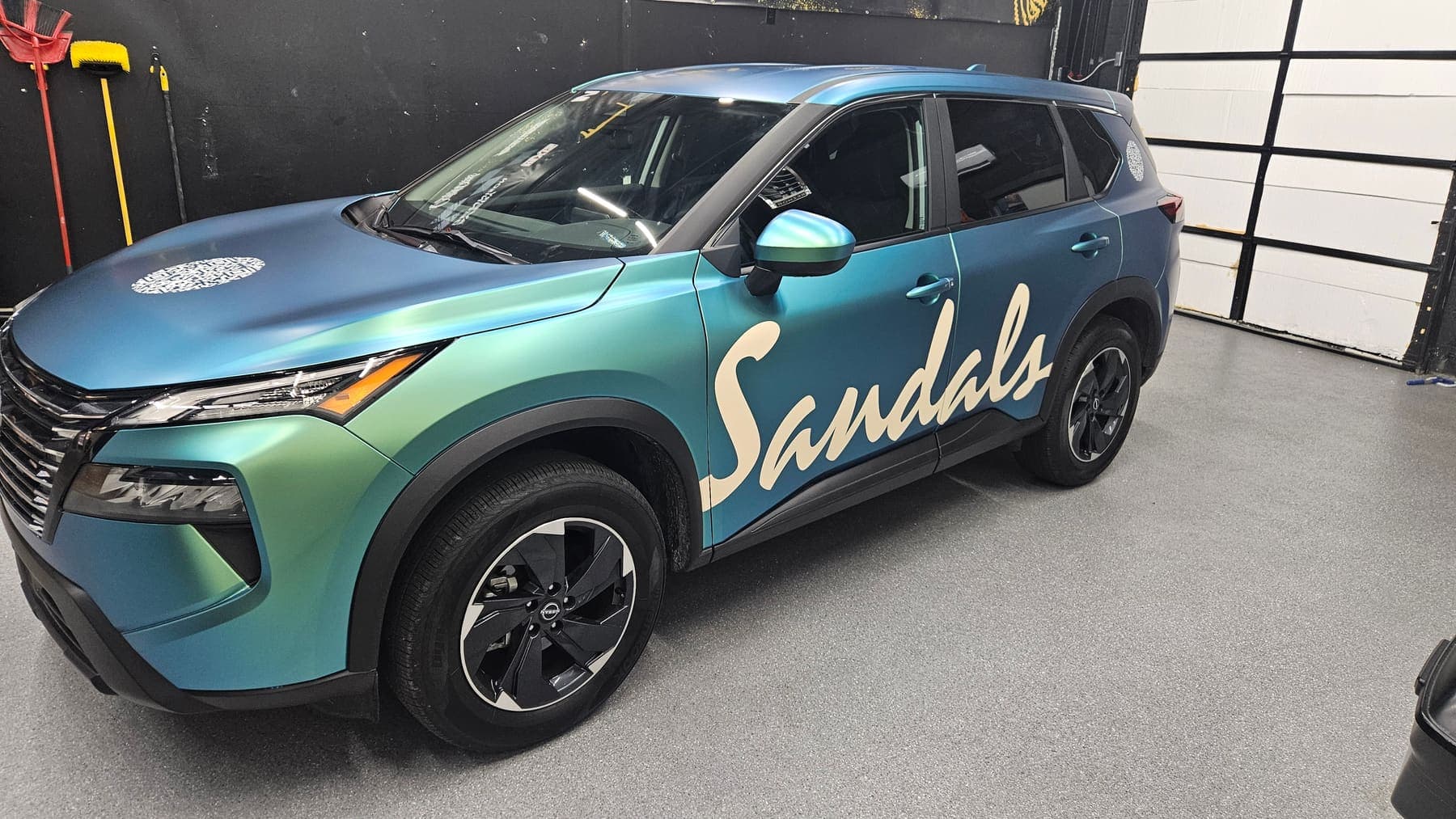 Nissan Rogue in a satin teal-to-purple color-shift wrap